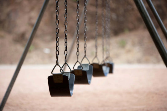 Why Swings are Not Attached to Play Structures on Commercial Playgrounds - Playtopia, Inc.